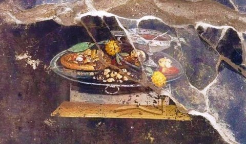 У Помпеях знайшли фреску зі стравою, дуже схожою на піцу: пояснюємо, що це за їжа